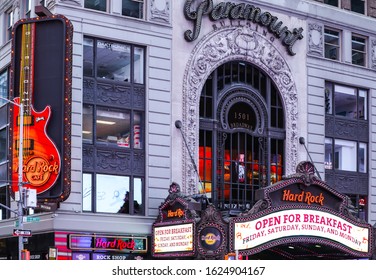 New York City, NY, USA 6/2/2019 — Hard Rock Cafe In The Middle Of Times Square At Late Afternoon. The Restaurant’s Iconic Guitar Icon Spins At The Corner Of The Building.