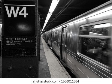 New York City, NY/ USA- 1-22-20: New York Subway Train At Soho Downtown West 4 Sign