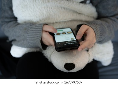 New York City, NY / USA - March 13, 2020: Young Person Ordering To Go From Starbucks App While Working From Home During Stay At Home Recommendations In Coronavirus Outbreak