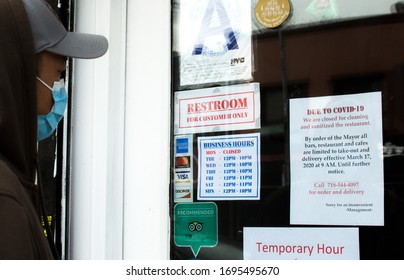 New York City, NY/ USA- 4-05-20: Person Looking At Closed Restaurant Sign Covid19 Coronavirus Pandemic Lockdown