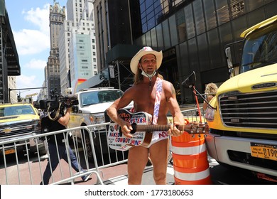 New York City NY USA July 9 2020 :  Famous Times Square Street Performer Naked Cowboy Who Are Singing In Front Of The Black Lives Matter Mural At Trump Tower In NYC.