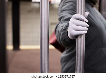 New York City, NY/ USA- 11-10-20: Passenger Wearing Gloves On New York Subway Riding The MTA Train During Covid Pandemic