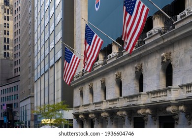 New York City, NY, USA - November 8 2020: New York Wall Street. American Flags Hanging From The New York Stock Exchange Building