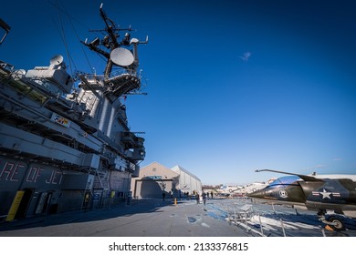 New York City, NY, USA - February 14th 2022: View of an US Marines AV-8 Harrier V-STOL next to the island on the flight deck of USS Intrepid, Intrepid Sea, Air and Space Museum, New York, NY, USA
