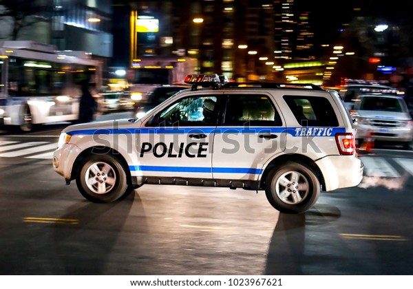 New York city, Ny / USA - 01/08/2014: Police\
car driving at night on the\
street