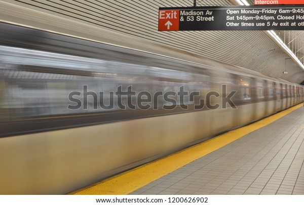 New York\
City, NY/ USA: 10-10-18- New York Subway Train Background Empty\
Subway Platform Fast Blurred Train\
Motion