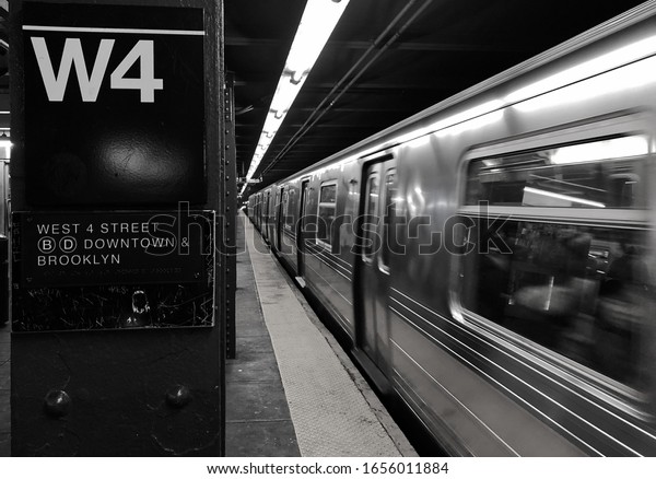 New York City, NY/ USA- 1-22-20: New York\
Subway Train at Soho Downtown West 4\
Sign