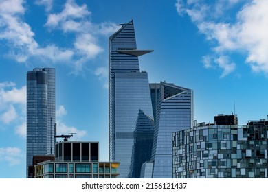 New York City, NY, USA-May 2022: Low Angle View Of  Skyscraper  With Sky Deck Observatory Edge In Hudson Yards And 100 Eleventh Av Residential Tower By Designer Frank Gehry In Background