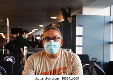 New York City, NY/US- 10/7/2020: A Group Of Passengers Traveling Together Adhere To CDC Guidelines Wearing Masks While Waiting For A Flight At JFK Airport.