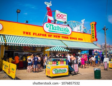 New York City, NY/USA - July 28, 2016: People gather at the famous hot dog restaurant, Nathan's, at Coney Island, NYC