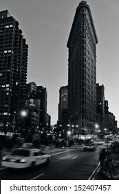 NEW YORK CITY - OCT 14: Traffic Under Flat Iron Building Facade On Oct 14, 2009 In Manhattan New York At Night.It's Considered To Be One Of The First Skyscrapers Ever Built Completed In 1902. (B/W)