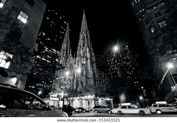 NEW YORK CITY - OCT 17 2009:Traffic under St. Patrick\'s\
Cathedral in Manhattan, New York City at night. St. Patrick\'s\
cathedral is the largest Gothic style cathedral in the United\
States of America. 