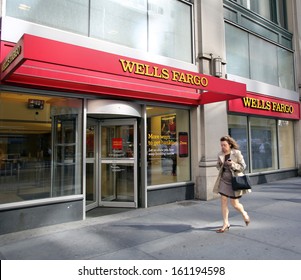 NEW YORK CITY - OCT 24 2013:  Pedestrians walk past a branch office of Wells Fargo & Company bank in Manhattan on Sunday, October 20, 2013. 