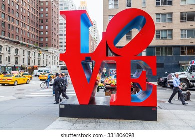 NEW YORK CITY - OCTOBER 07, 2015: Love sculpture in Midtown Manhattan with unidentified people. It is from artist Robert Indiana, a pop art artist, His media include paper and Cor-ten steel sculpture.