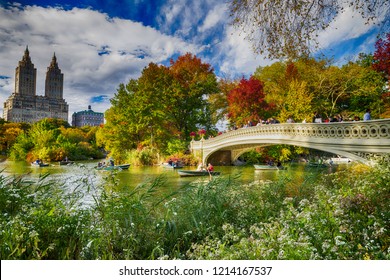 NEW YORK CITY - OCTOBER 2015: Tourists and local make a boat tour in Central Park Lake. The city attracts 50 million people annually. - Shutterstock ID 1214167537
