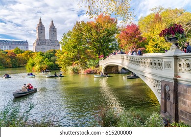 NEW YORK CITY - OCTOBER 2015: Tourists in Central Park enjoy foliage season. The city attracts 50 million people annually.