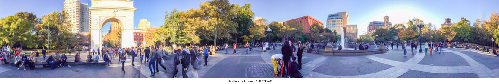 NEW YORK CITY - OCTOBER 2015: Tourists in Washington Park. New York attracts 50 million people annually.