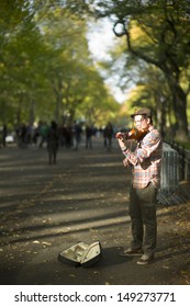 NEW YORK CITY - OCTOBER 9: A Violinist Is Busking In Central Park's Bethesda Terrace, A Popular Tourist Attraction October 9, 2012 In New York, NY. The Park Is Famous For Different Street Performance.