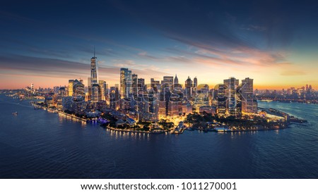Photo of New York City panorama skyline at sunrise. Manhattan office buildings / skysrcapers at the morning. New York City panoramatic shot.