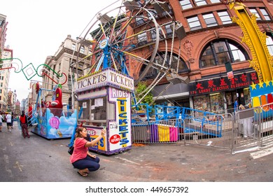 NEW YORK CITY - SEPTEMBER 13, 2013:  Street View Of Carnival Amusement Rides In  During The Feast Of San Gennaro In Little Italy In Downtown Manhattan. 