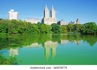 New York City, September 14, 2014: walking in Central Park, skyline with view of The San Remo (145 Central Park West), a luxury, 27-floor, co-operative apartment building in Manhattan opened in 1930