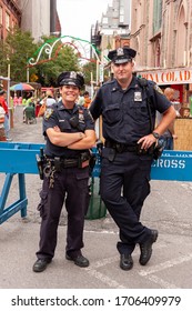 NEW YORK CITY - SEPTEMBER 17, 2010: New York police officers posing for a photo in the Little Italy district