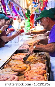 NEW YORK CITY - SEPTEMBER 22: Vendors Cooking And Serving Food At The San Gennaro Festival In New York City On September 22, 2013.