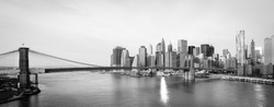 New York City Skyline With  Brooklyn Bridge And  Lower Manhattan View In Early Morning Sun Light - Black And White