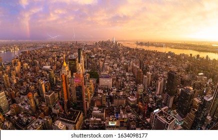 New York City skyline with Manhattan skyscrapers at dramatic vibrant after the storm sunset, USA. Rainbow can be seen in background over Brooklyn bridge. - Powered by Shutterstock