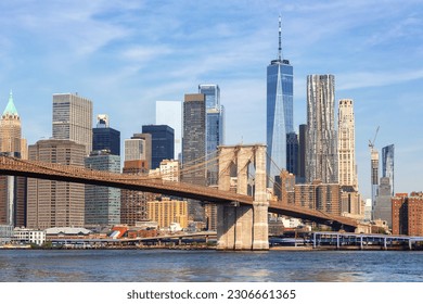 New York City skyline of Manhattan with Brooklyn Bridge and World Trade Center skyscraper traveling in the United States - Shutterstock ID 2306661365