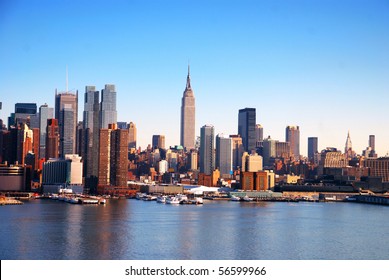 New York City Skyline over Hudson river with boats and skyscrapers.