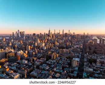 New York City skyline panorama at sunrise. Midtown Manhattan building on horizon, clear sky, copy space - Shutterstock ID 2246956227