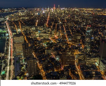 New York City skyline with urban skyscrapers at night
					Photo taken from freedom tower Ground Zero observatory