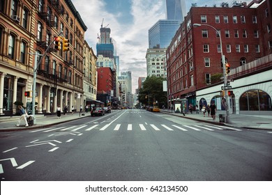 New York City street road in Manhattan at summer time. Urban big city life concept background.