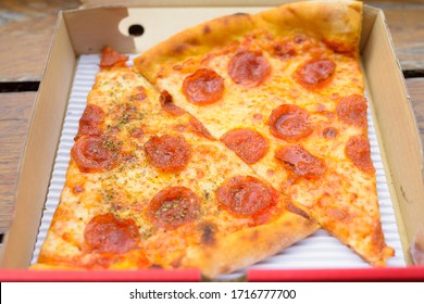 New York City Style Italian Pepperoni Pizza Slices In Take Away Box