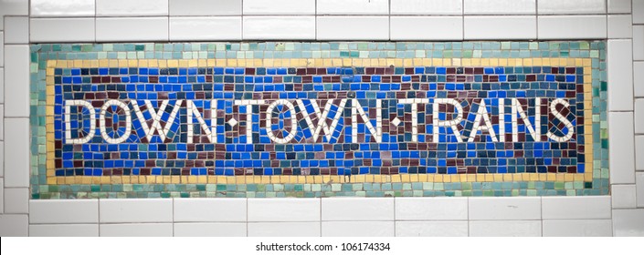 New York city subway sign tile pattern in midtown Manhattan station.