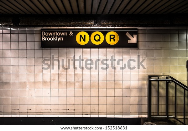 New York City subway with\
sign