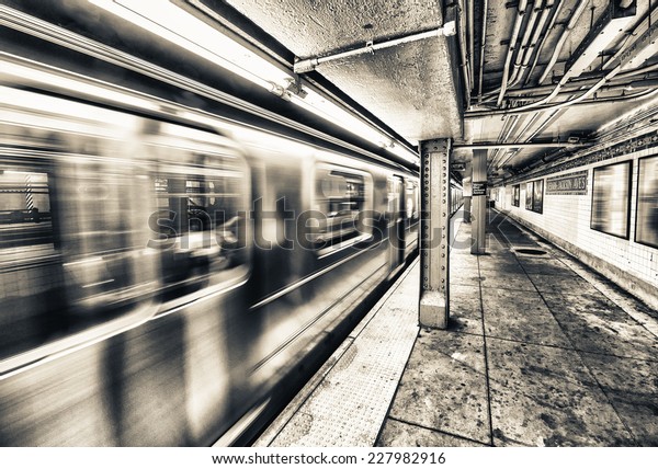 New York City subway\
train speeding up.