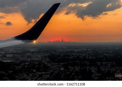 New York City. Sunset Over The Manhattan Skyline From A Charter Flight