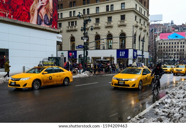 New York city taxi\'s passing by the Victoria\
Secret\'s store in Manhattan. Manhattan, New York, USA February 20,\
2014.
