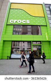 NEW YORK CITY - THURSDAY, DECEMBER 31, 2015: Pedestrians Walk Past The Flagship Retail Store For Shoe Manufacturer Crocs, Inc.