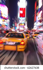 New York City Times Square With Yellow Cab And Busy Traffic.