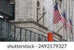 New York City United States. Manhattan Downtown Financial District urban architecture. American Flag on Wall street near Stock Exchange, Federal Hall building, USA Stock Market. Hot steam smoke stack.