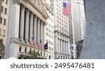 New York City, United States. Lower Manhattan Downtown Financial District urban architecture exterior. American flag. Wall street Stock Exchange building facade columns, USA Stock Market trading, NYC.