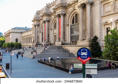 New York City, United States - August 25, 2008: Facade Of The Metropolitan Museum Of Art, With People Sitting On The Stairs, And Fountains.