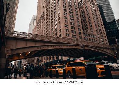 New York City, New York / United States - January 10, 2020: The Outside Traffic On The Street Surrounding Grand Central Station. The Taxis Wait For Passengers On A Cloudy Day In The City. 