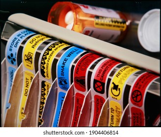 NEW YORK CITY, UNITED STATES - Jan 14, 2021: Pharmacy Drug Warning Label Dispenser