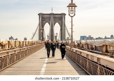 New York City, New York, United States 24 Mar 2013: People Walking On Brooklyn Bridge With Street Lamp In The Evening, NYC