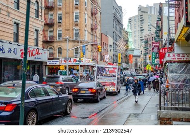 New York City, New York, United States 25 Mar 2013: Traffic Jam At China Town New York City On A Rainy Winter Day With People Walking With Umbrellas On Sidewalk