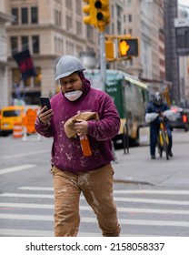 NEW YORK CITY, UNITED STATES - Jan 25, 2022: A Shot Of A Construction Worker During His Lunch Break In New York City